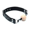 A black leather collar with a wooden ball on it.