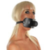 A woman wearing a black leather muzzle.