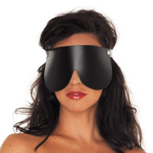 A woman wearing a black leather eye mask.