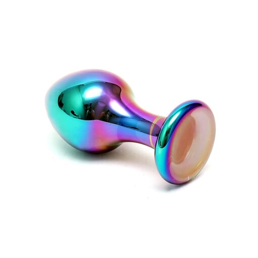 A rainbow colored glass pipe on a white surface.