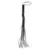 A black tassle is hanging on a white background.