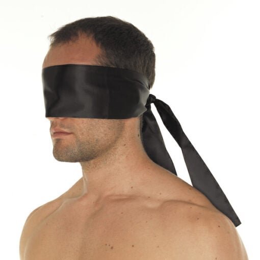 A man with a blindfold on his face.
